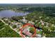 Aerial shot of a waterfront property with a private pool and access to the canal at 1902 Rebecca Rd, Lutz, FL 33548