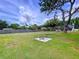 Picturesque backyard with a cozy fire pit area, perfect for outdoor entertaining and relaxation at 1902 Rebecca Rd, Lutz, FL 33548