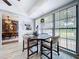 Eat-in kitchen features contemporary light fixtures and large windows offering backyard views and natural light at 1902 Rebecca Rd, Lutz, FL 33548