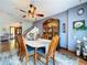 Elegant dining room with a chandelier, comfortable seating, and tasteful decor, perfect for gatherings at 1902 Rebecca Rd, Lutz, FL 33548