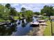 Scenic waterfront view featuring private docks, boat lifts, and calm waters, ideal for boating enthusiasts at 1902 Rebecca Rd, Lutz, FL 33548