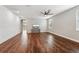 Open concept living room with lots of light, and beautiful wood floors at 19191 Pease Pl, Lutz, FL 33558