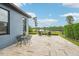 Lake view with outdoor patio seating, beautiful landscaping, and wrought iron fence at 19191 Pease Pl, Lutz, FL 33558