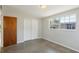 Light-filled bedroom featuring fresh paint, large window, and a spacious closet at 2044 Temple Ter, Clearwater, FL 33764