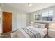 Cozy bedroom with soft carpet, neutral paint, a comfortable bed, and natural light at 2044 Temple Ter, Clearwater, FL 33764