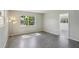 A bright bedroom features a window and open access to the next room at 2044 Temple Ter, Clearwater, FL 33764