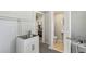 Laundry Room with view to kitchen and bathroom, utility sink, updated fixtures at 2044 Temple Ter, Clearwater, FL 33764