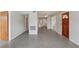 Neutral-toned living room featuring polished floors and well-lit interior at 2044 Temple Ter, Clearwater, FL 33764