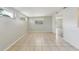 Spacious living room with tile flooring, neutral paint, and natural light at 2044 Temple Ter, Clearwater, FL 33764