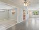 Bright living room featuring durable flooring, natural light, and a ceiling fan at 2044 Temple Ter, Clearwater, FL 33764