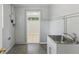 Functional utility room with a practical sink and clean, neutral finishes at 2044 Temple Ter, Clearwater, FL 33764