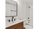 Updated bathroom features stylish vanity and mirror, plus a tub with shower at 216 36Th N Ave # 202B, St Petersburg, FL 33704