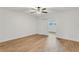 Spacious bedroom with wood-style tile flooring and a ceiling fan, complemented by a closet and an open doorway at 216 36Th N Ave # 202B, St Petersburg, FL 33704