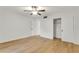 Spacious bedroom with ceiling fan, closet, and wood flooring at 216 36Th N Ave # 202B, St Petersburg, FL 33704