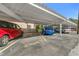 Community carport showcasing multiple cars under the shelter at 216 36Th N Ave # 202B, St Petersburg, FL 33704