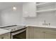 Modern kitchen features white subway tile backsplash and stylish brass hardware at 216 36Th N Ave # 202B, St Petersburg, FL 33704