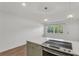Kitchen island featuring a smooth cooktop in this open and bright space at 216 36Th N Ave # 202B, St Petersburg, FL 33704
