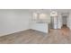 Bright kitchen boasts white cabinets, modern appliances, a convenient island, and stylish pendant lighting at 216 36Th N Ave # 202B, St Petersburg, FL 33704