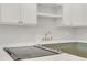 Modern kitchen features white subway tile backsplash and stylish brass hardware at 216 36Th N Ave # 202B, St Petersburg, FL 33704