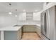 Updated kitchen with modern appliances, white cabinets, and a large island at 216 36Th N Ave # 202B, St Petersburg, FL 33704