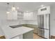 Updated kitchen with modern appliances, white cabinets, and a large island at 216 36Th N Ave # 202B, St Petersburg, FL 33704