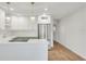 Bright kitchen features white cabinets, stainless steel appliances, a sleek island, and modern pendant lights at 216 36Th N Ave # 202B, St Petersburg, FL 33704