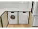 Modern, concealed washer and dryer tucked away behind stylish cabinets at 216 36Th N Ave # 202B, St Petersburg, FL 33704