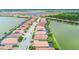 Community overview featuring lakefront homes with lush landscaping and easy access to waterfront views at 222 Toscavilla Blvd, Nokomis, FL 34275