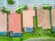 Aerial view of houses with private pools and lake views, showcasing community living and outdoor amenities at 222 Toscavilla Blvd, Nokomis, FL 34275