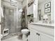 Elegant bathroom featuring a tiled shower, white vanity, and modern fixtures at 222 Toscavilla Blvd, Nokomis, FL 34275