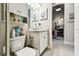 Bathroom featuring a decorative vanity, toilet, and linen closet at 222 Toscavilla Blvd, Nokomis, FL 34275