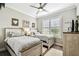 Charming bedroom featuring two beds, soft natural light, and a ceiling fan at 222 Toscavilla Blvd, Nokomis, FL 34275