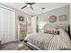 Neutral bedroom featuring a comfortable bed, decorative design elements and dresser at 222 Toscavilla Blvd, Nokomis, FL 34275