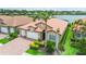 Well maintained home with a three car garage, brick driveway, and beautiful landscaping at 222 Toscavilla Blvd, Nokomis, FL 34275