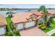Beautiful home with a three car garage, lovely landscaping, and a tile roof at 222 Toscavilla Blvd, Nokomis, FL 34275