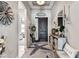 Welcoming foyer with stylish decor, elegant console table, and views to the living space at 222 Toscavilla Blvd, Nokomis, FL 34275