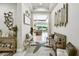Inviting hallway with views of the living area, featuring elegant decor and ample natural light at 222 Toscavilla Blvd, Nokomis, FL 34275