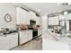 Bright kitchen featuring an island with an open concept layout at 222 Toscavilla Blvd, Nokomis, FL 34275