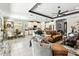 Open concept living space featuring modern furnishings, dining area, and a stylish kitchen at 222 Toscavilla Blvd, Nokomis, FL 34275