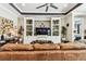 Comfortable living room with a built-in entertainment center and stylish decor at 222 Toscavilla Blvd, Nokomis, FL 34275