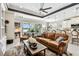 Spacious living room with a view into the kitchen and outdoor patio at 222 Toscavilla Blvd, Nokomis, FL 34275