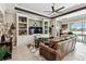 Living room with a cozy rug and a custom entertainment center at 222 Toscavilla Blvd, Nokomis, FL 34275