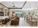 Open concept area featuring a view of the living room, kitchen, and water view at 222 Toscavilla Blvd, Nokomis, FL 34275