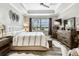 Bright and inviting main bedroom featuring modern decor, ample natural light, and a peaceful atmosphere for relaxation at 222 Toscavilla Blvd, Nokomis, FL 34275