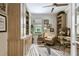 Office space includes built-in shelving, a large window, and a ceiling fan at 222 Toscavilla Blvd, Nokomis, FL 34275