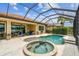 Relaxing screened lanai with a pool and spa, perfect for enjoying the beautiful lake views and outdoor living at 222 Toscavilla Blvd, Nokomis, FL 34275
