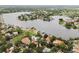 Aerial view of waterfront homes, boat docks, and lush green landscape at 2227 Brevard Ne Rd, St Petersburg, FL 33704
