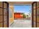 View from the balcony to a red-roofed building against a bright blue sky at 2227 Brevard Ne Rd, St Petersburg, FL 33704