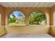 View from the balcony showcasing decorative archways that frame the surrounding neighborhood at 2227 Brevard Ne Rd, St Petersburg, FL 33704