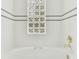 Close up of tub with decorative glass block window at 2227 Brevard Ne Rd, St Petersburg, FL 33704